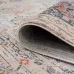 Close-up of the folded edge of Babylon Rose Rug, highlighting its intricate border design and durable construction.