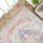 Close-up view of the Ishtar Medallion Rug in Dusty Azure, showcasing intricate medallion patterns and fine craftsmanship.