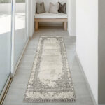 Mist Haven Rug runner with a distressed gray and cream design, styled in a minimalist hallway with natural light and soft furnishings.
