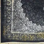 Close-up of the Algiers Rug’s intricate border, showcasing elegant Persian motifs in black, ivory, and gold with hand-finished fringes.