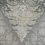 Macro close-up of Alhambra Royal Rug highlighting its dense weaving, intricate Persian floral patterns, and premium 1200 reeds, 3600 density acrylic material.