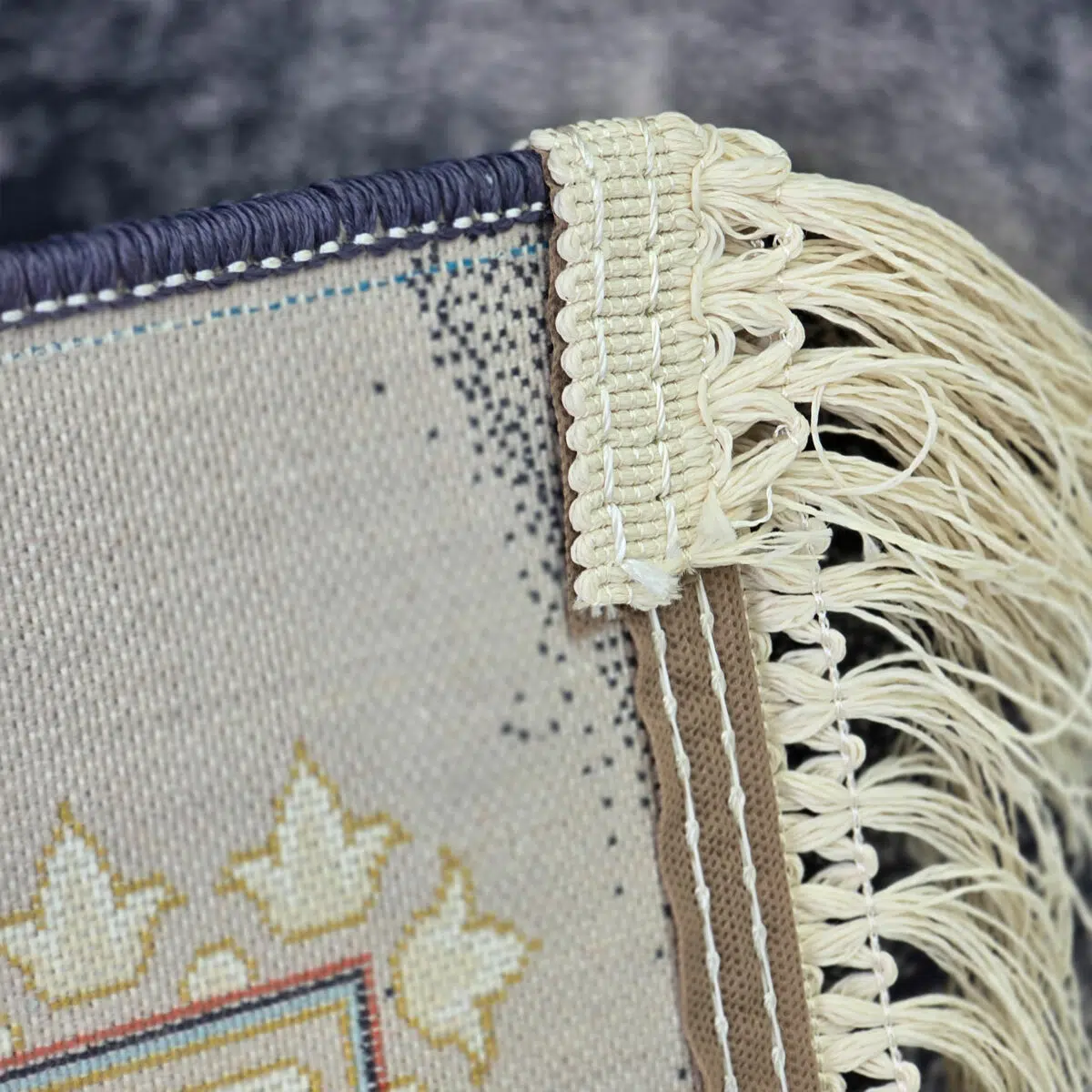 Close-up of the Baghdad Carpet’s cotton backing and hand-knotted fringes, showcasing premium craftsmanship and durability.