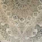 Close-up view of Celestial Carpet, showcasing its intricate floral medallion, arabesque detailing, and distressed vintage aesthetic, woven with 1200 reeds and 3600 density for luxury interiors and high-end wholesale buyers.