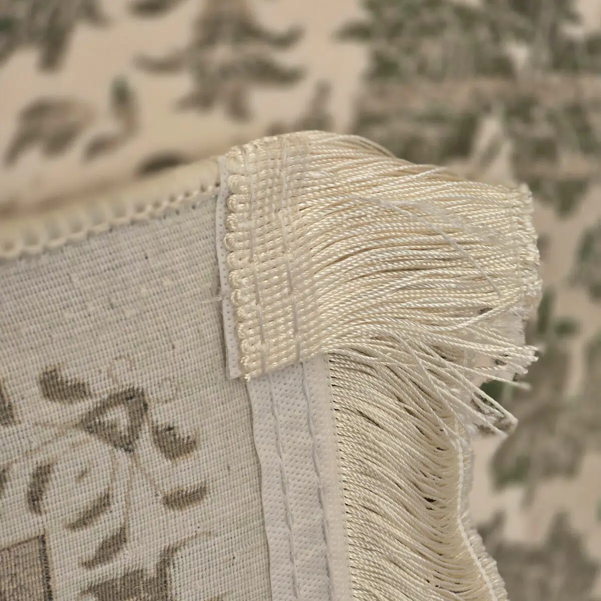 Close-up of Celestial Carpet’s fringe and microfilament backing, showcasing its hand-knotted detailing, reinforced edges, and premium 1200 reeds weaving for luxury interiors and wholesale buyers.