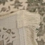 Close-up of Celestial Carpet’s fringe and microfilament backing, showcasing its hand-knotted detailing, reinforced edges, and premium 1200 reeds weaving for luxury interiors and wholesale buyers.