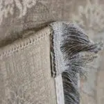 Close-up of Damascus Heritage Rug’s fringe and microfilament backing, showcasing its hand-knotted detailing, reinforced edges, and premium 1200 reeds weaving for luxury interiors and wholesale buyers.