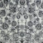 A close-up of the fine floral patterns on the Dubai Carpet, intricately woven for a timeless look.