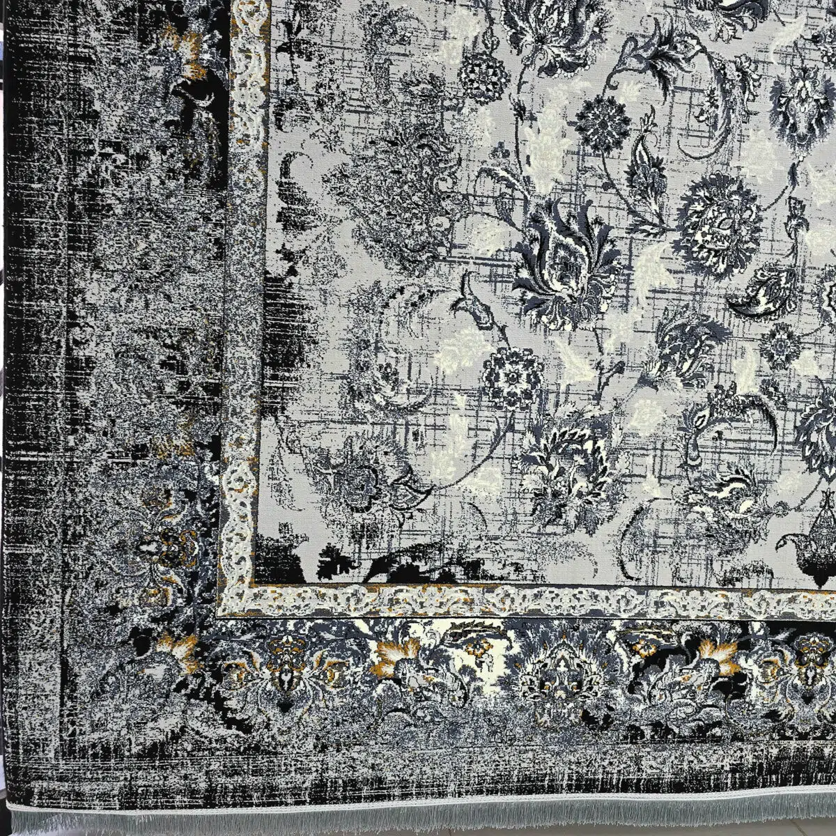 A luxurious black and gold Persian carpet with intricate floral patterns, perfect for modern interiors.