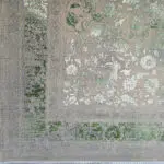 Close-up of the Emerald Carpet’s border, featuring intricate floral detailing, distressed green tones, and a vintage-inspired aesthetic.