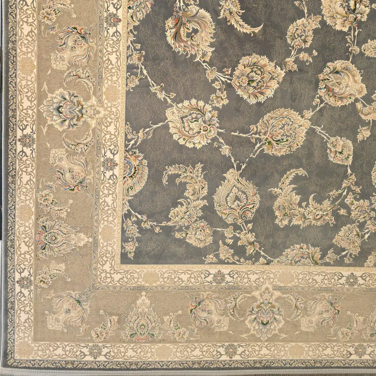 A close-up of the Malik Carpet’s intricate corner and border design, featuring floral motifs in beige, navy blue, and soft pastels. This 1200 reeds carpet blends traditional elegance with modern luxury.