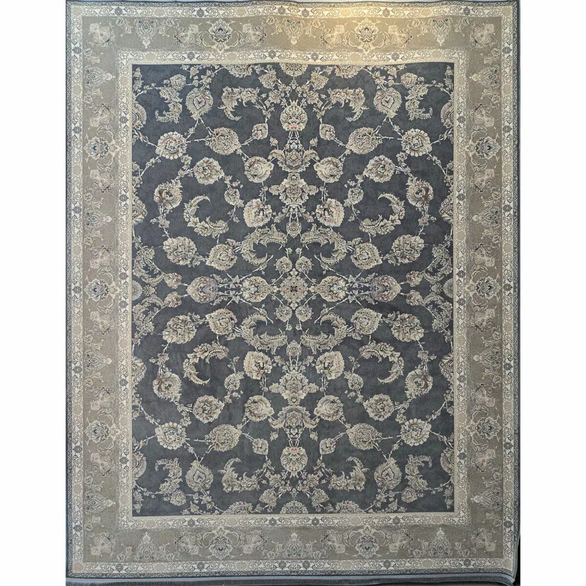A detailed close-up of the Malik Carpet, showcasing intricate floral patterns in navy blue and beige, woven with 1200 reeds for superior quality.