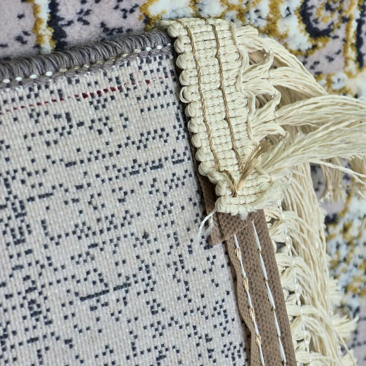 Close-up of the Najran Carpet’s cotton backing and hand-knotted fringes, showcasing premium craftsmanship and durability.