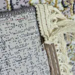 Close-up of the Najran Carpet’s cotton backing and hand-knotted fringes, showcasing premium craftsmanship and durability.