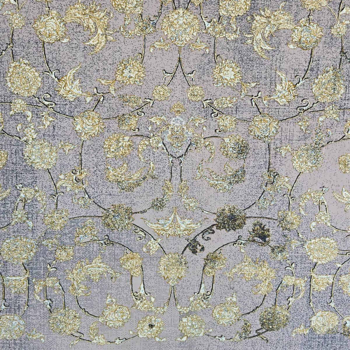 Close-up of the Najran Carpet, highlighting its detailed floral motifs with gold and silver accents, woven with precision.