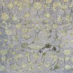 Close-up of the Najran Carpet, highlighting its detailed floral motifs with gold and silver accents, woven with precision.