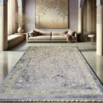 The Najran Carpet, a high-end classic rug featuring an intricate floral pattern with soft gold and silver hues, ideal for luxury interiors.