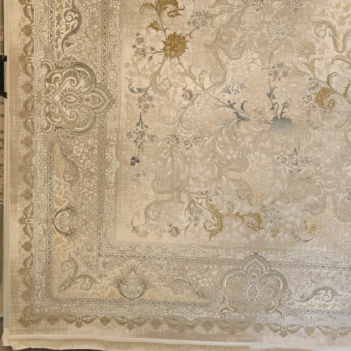 Close-up of Noor Carpet’s elegant border and floral motifs, showcasing intricate Persian craftsmanship in warm beige and gold tones.
