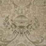 A highly detailed close-up of Noor Carpet, featuring an exquisite Persian dome-inspired motif with floral embellishments in warm beige and gold.