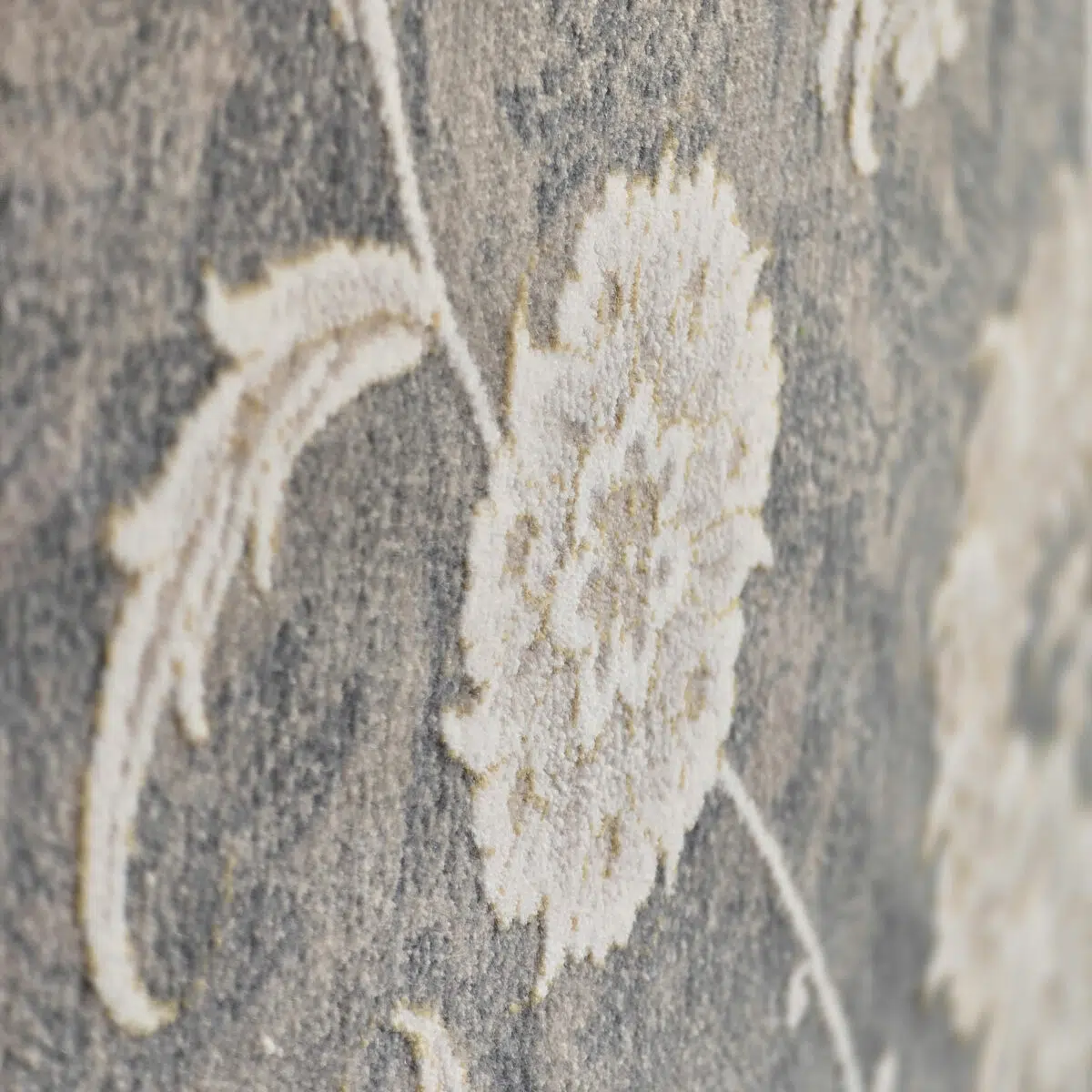 Close-up of the Royal Bloom Carpet’s floral motif, showcasing its high-density 1200 reeds weaving and soft textured pile.