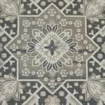 Close-up of the medallion design in Royal Heriz Carpet, featuring detailed geometric and floral patterns in beige, green, and grey tones.