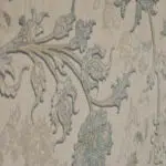 Close-up of the Seraphic Carpet’s intricate floral vine design in soft blue and beige, woven with precision for a timeless aesthetic.