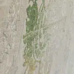 Close-up of the Sultan Carpet’s raised floral patterns in green and gold, highlighting its high-quality texture and craftsmanship.