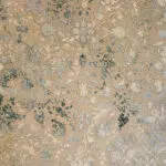 Close-up view of the Zamzam Carpet’s detailed floral patterns, featuring delicate beige, green, and soft blue accents in an elegant woven texture.