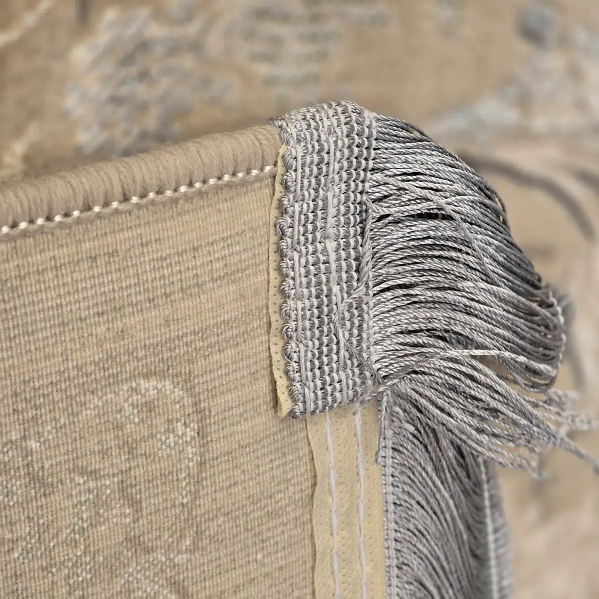 A detailed view of the Zamzam Carpet’s high-quality fringe and reinforced microfilament backing, ensuring longevity and an elegant finish.