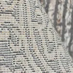 Close-up view of the Andalus modern rug's high-quality woven texture, featuring intricate detailing and premium craftsmanship.