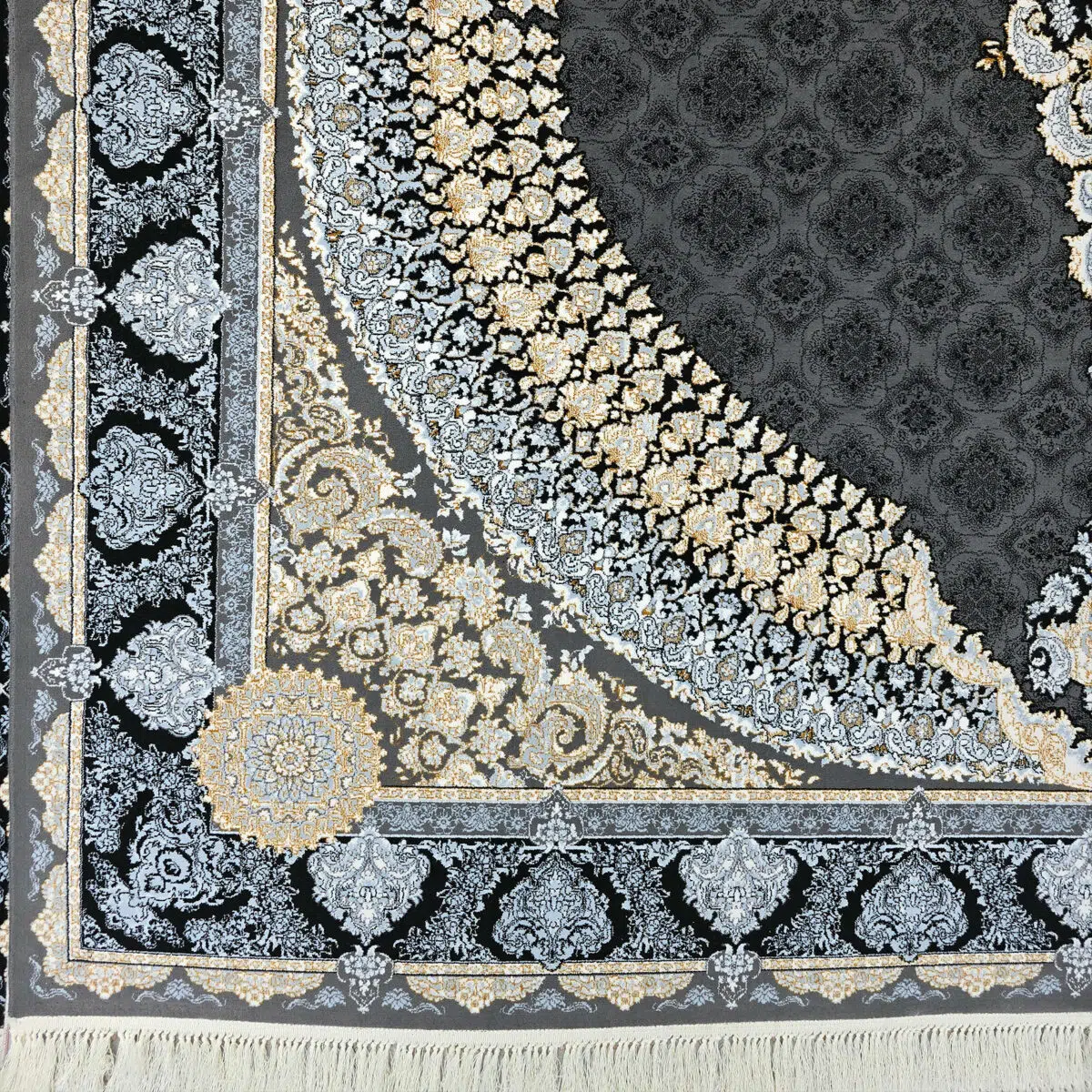 A detailed look at the intricate floral border design of the Doha Majesty Carpet in black and gold.