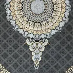 A detailed image of the central medallion pattern on the Doha Majesty Carpet, featuring intricate floral detailing.