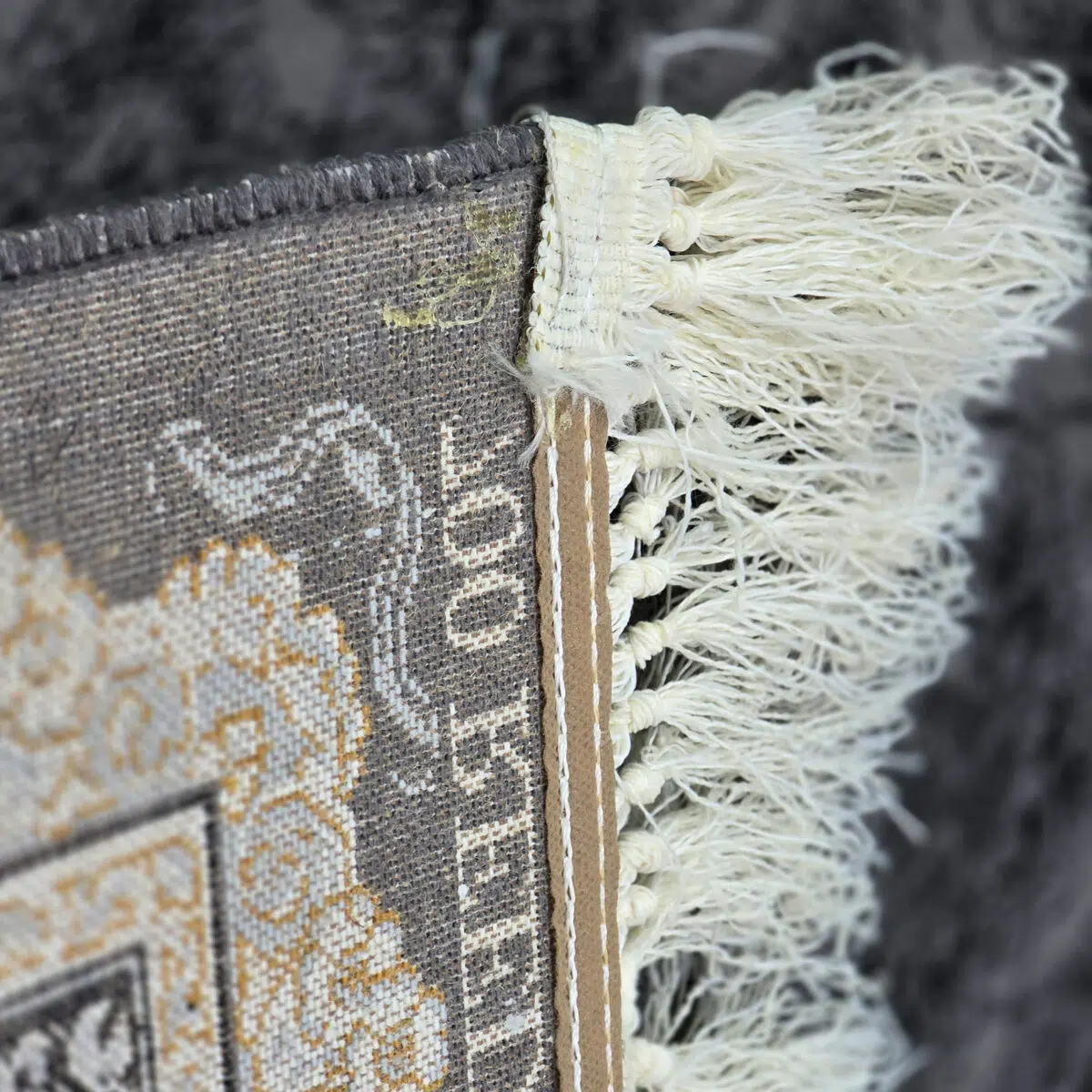 Close-up of Doha Majesty Carpet’s durable jute and polyester backing with fine craftsmanship.