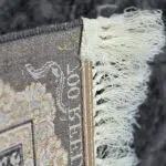 Close-up of Doha Majesty Carpet’s durable jute and polyester backing with fine craftsmanship.