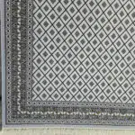 Close-up of the Manama Harmony Carpet’s intricate border with traditional Arabic geometric patterns.