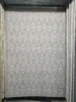 Full view of Atlas rug with flame-shaped minimalist pattern