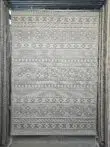 Full hanging view of Equinox rug with grey-white diamond patterns and modern ethnic stripes