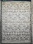 Full view of Radiant beige rug with layered diamond and stripe motifs