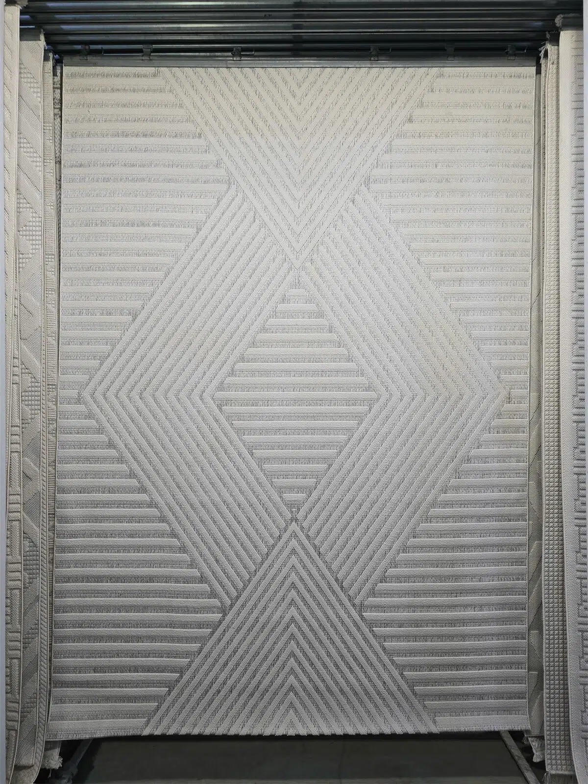 close-up of Solaris Rug with diagonal geometric texture in soft beige tones
