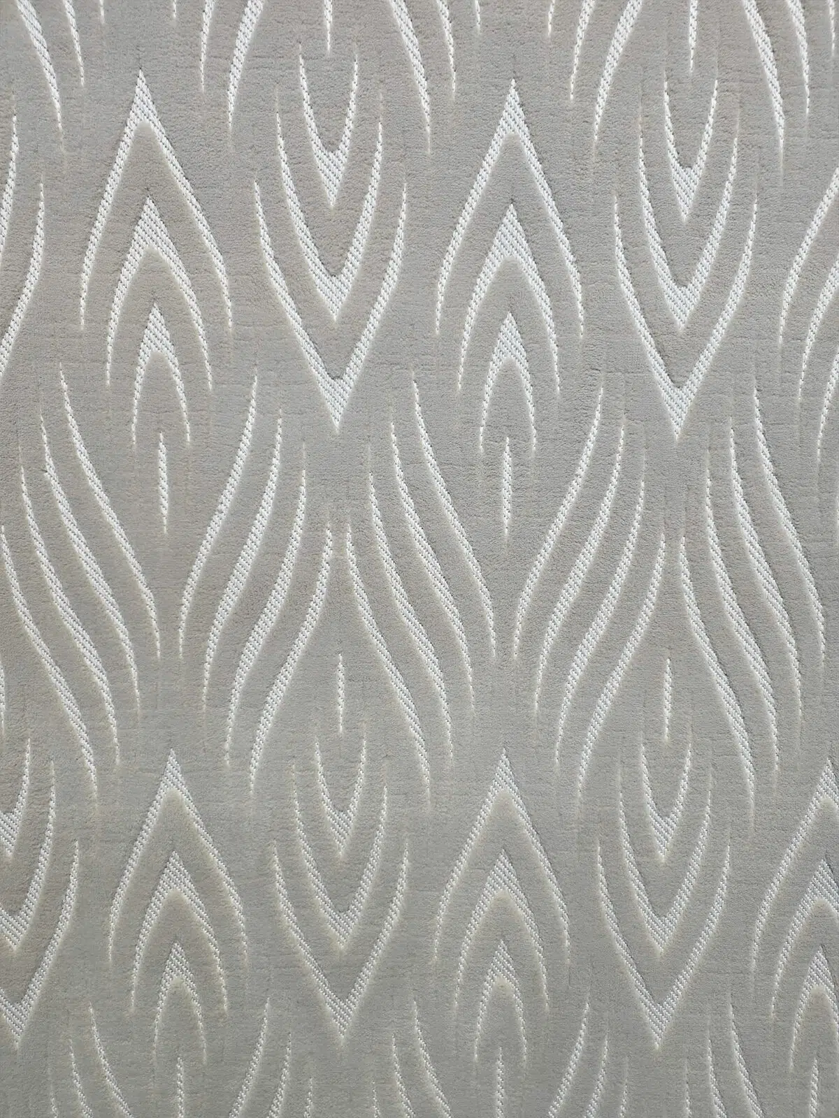Close-up showing the Atlas rug’s elegant flame motif