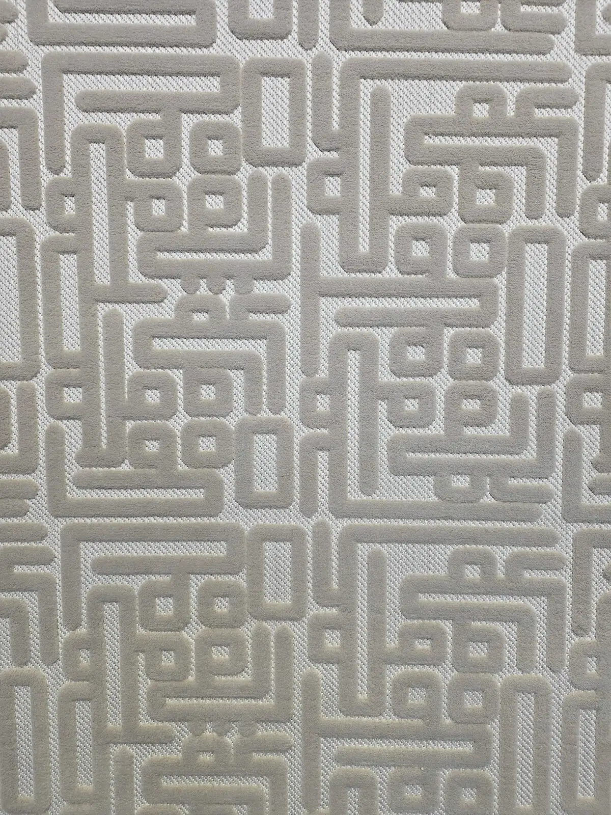 Close-up of Aurora rug’s soft feather-shaped design