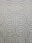 Detailed look at Nebula rug pattern with 3D loop design and concentric arcs