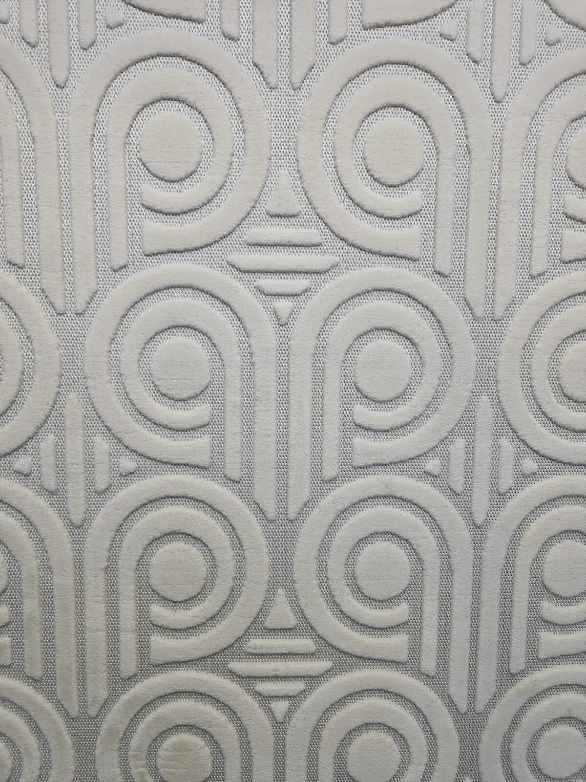 Detailed look at Nebula rug pattern with 3D loop design and concentric arcs