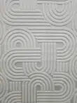 Close-up showing Sirius rug’s soft curved pattern and texture
