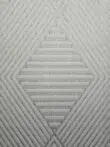 central diamond pattern of Solaris Rug in beige chevron texture