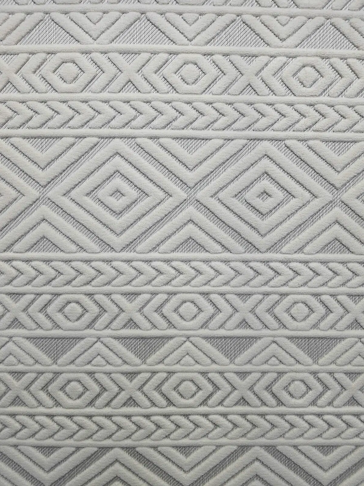 Close-up of Luna rug’s central area with textured white diamond and line patterns