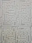 Center close-up showing the raised Kufic-style texture on Vega Rug