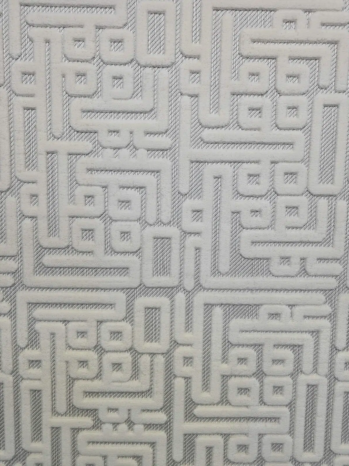 Center close-up showing the raised Kufic-style texture on Vega Rug