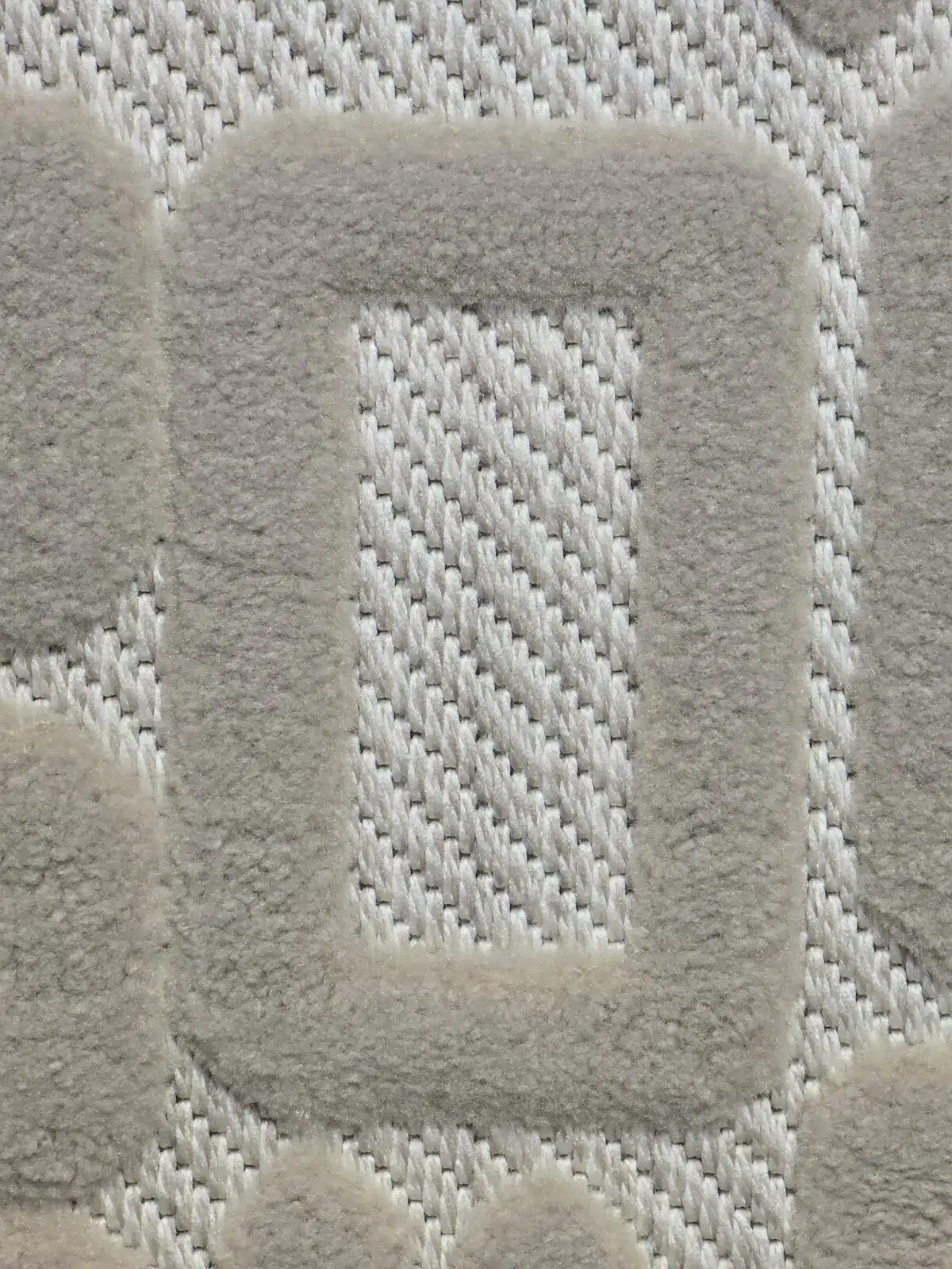 Macro detail of Aurora rug showing raised acrylic weave