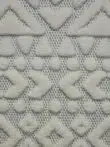 Extreme close-up of Nova rug’s triangle and dot shapes with high-pile finish