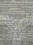 Macro shot showing tight woven base and elevated lattice pattern on Twilight Rug